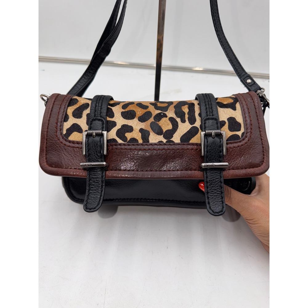 The Sak Black Leather Leopard Calf Hair Crossbody Bag Brown Trim Buckle Detail